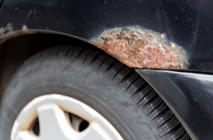 rusty spots on the car - close-up rust spot car