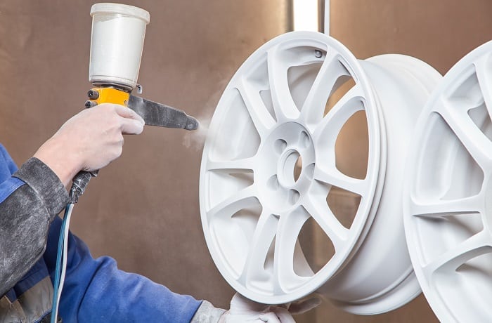 Process of powder coating auto wheels in workshop