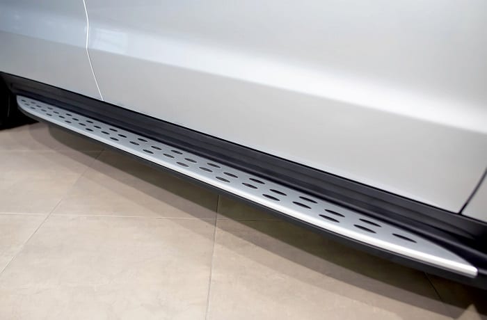 Modern footboard on an SUV car for the convenience of passengers and car tuning.